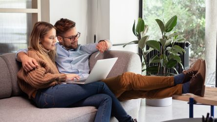 Couple with Laptop on Couch